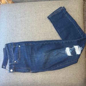 Never before worn. Gap mid blue wash curvy skinny denim with rips on both knees.